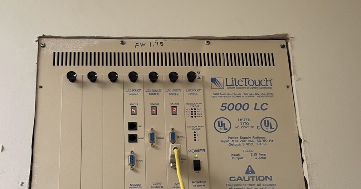 LiteTouch Central Control Unit panel enclosure with dimmer and relay modules mounted inside