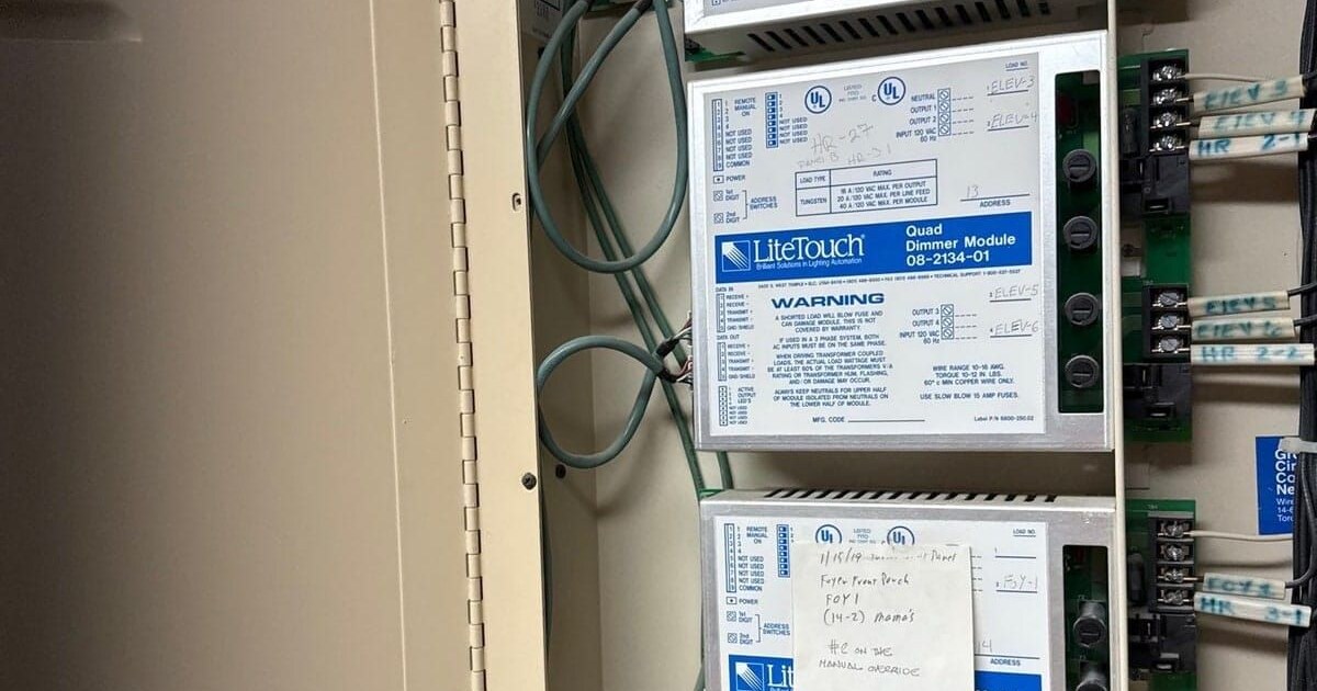 LiteTouch Quad Dimmer Module 08-2134-01 inside an original equipment panel, with hand-labelled circuits and a technician's service note, photographed on a Grizzly Tec job in the Houston area