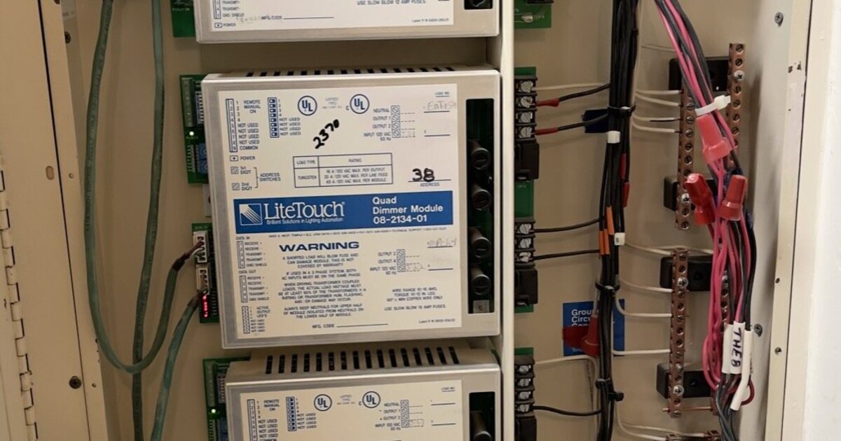 Homeowner reviewing LiteTouch system documentation before a smart home replacement quote