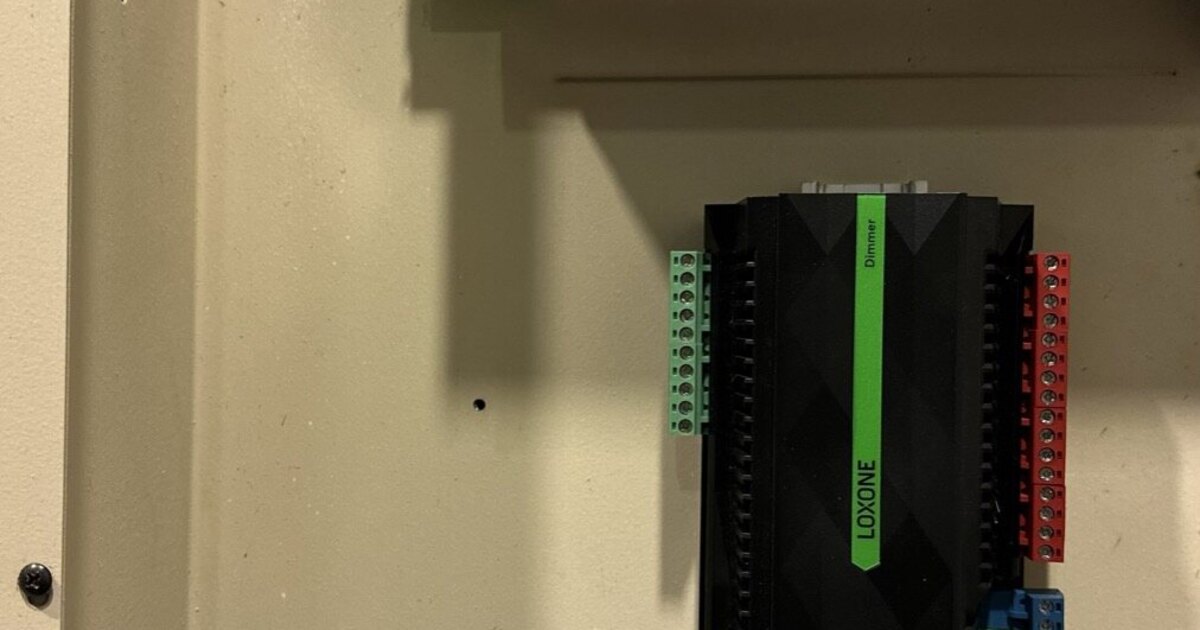 Side-by-side comparison of a LiteTouch keypad and a modern Loxone Touch Pure switch