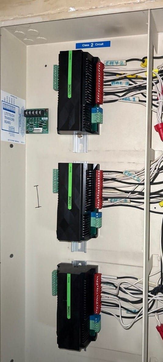 Modern LOXONE Miniserver and extension panel installed in the same mechanical room — replacing the legacy LiteTouch panel