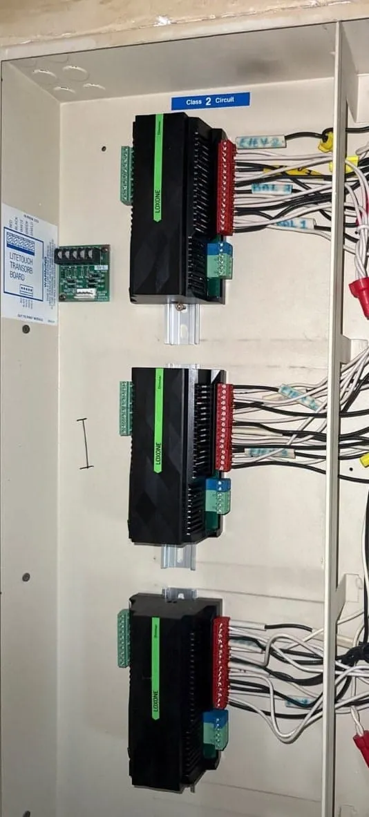 LOXONE extension modules mounted on a DIN rail inside a panel