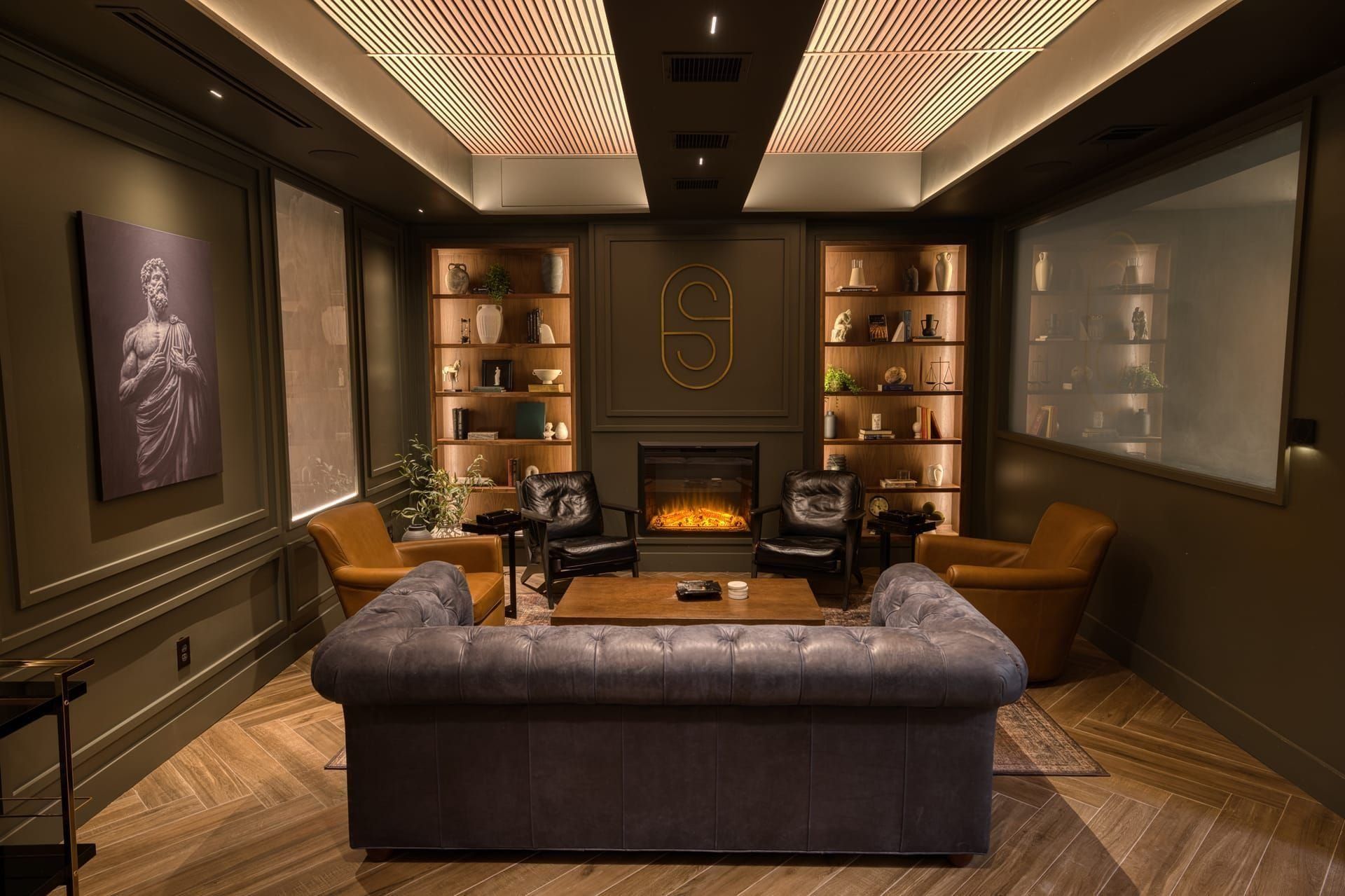 Cigar Lounge — commercial LOXONE automation with fireplace and architectural lighting