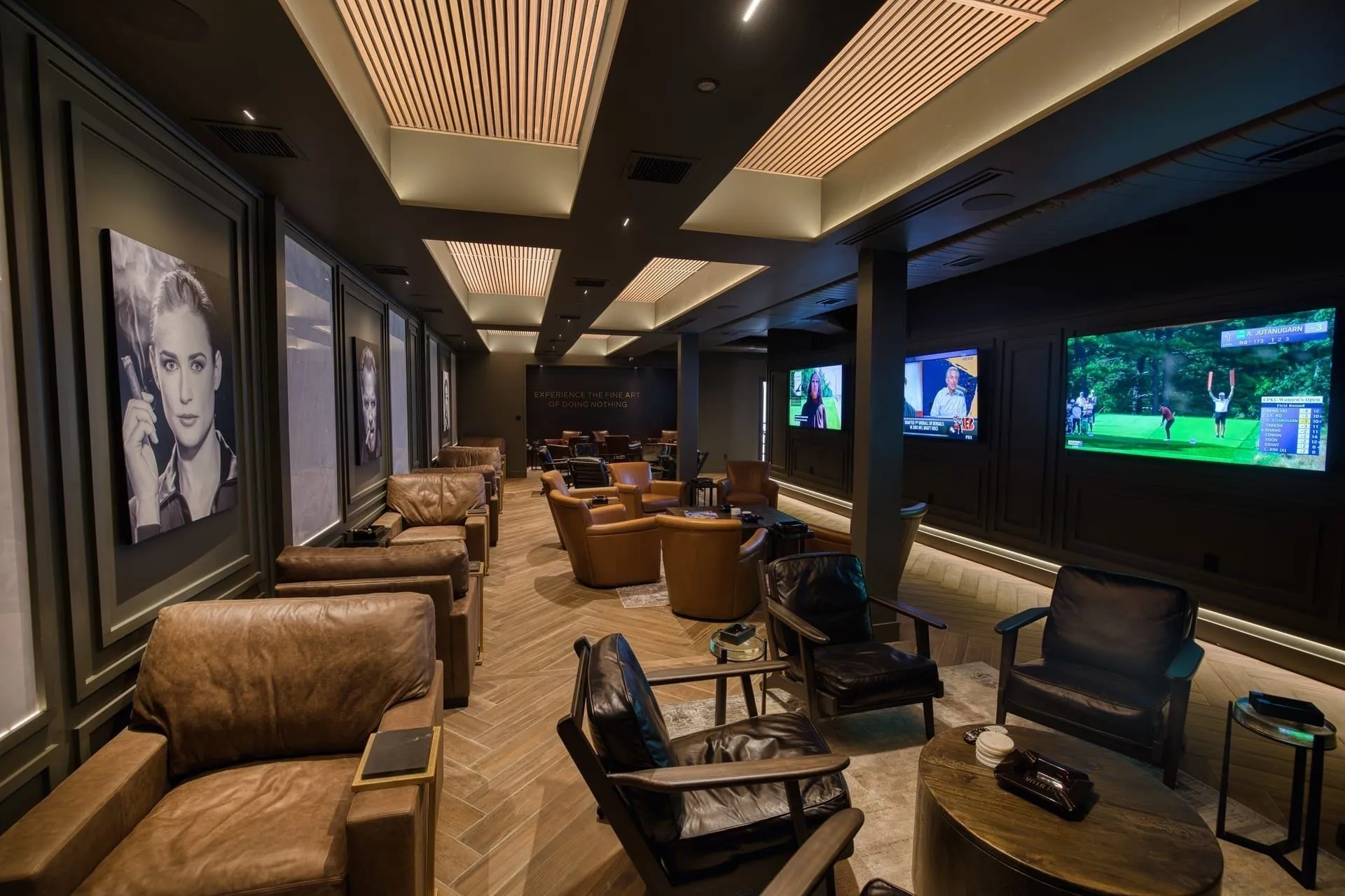 Stoa Fine Cigars + Spirits lounge — layered atmospheric lighting in full effect